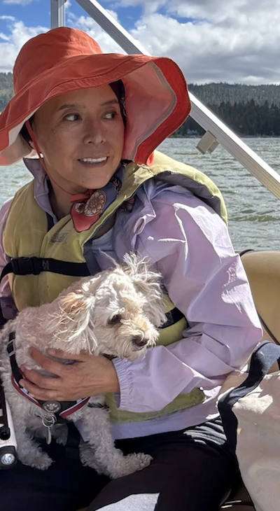 Hesty with Quark on a boat, cropped from the original family photograph